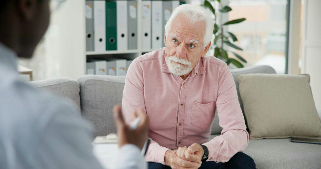 Psychologist, therapy or old man consulting in counselling for depression or support in consultatio